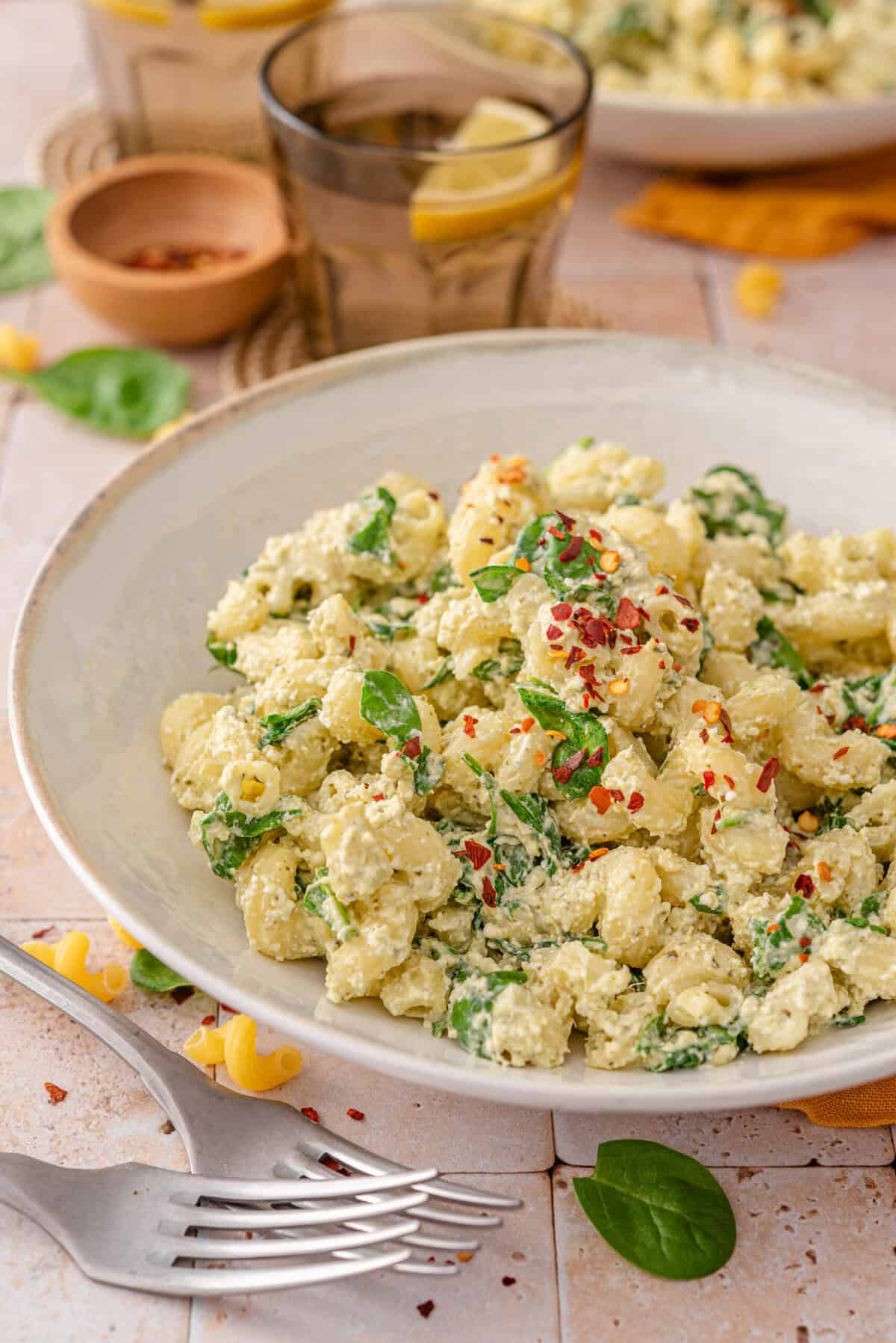 this is a side view close up of my Easy & Healthy High Protein Creamy Pesto Pasta Salad