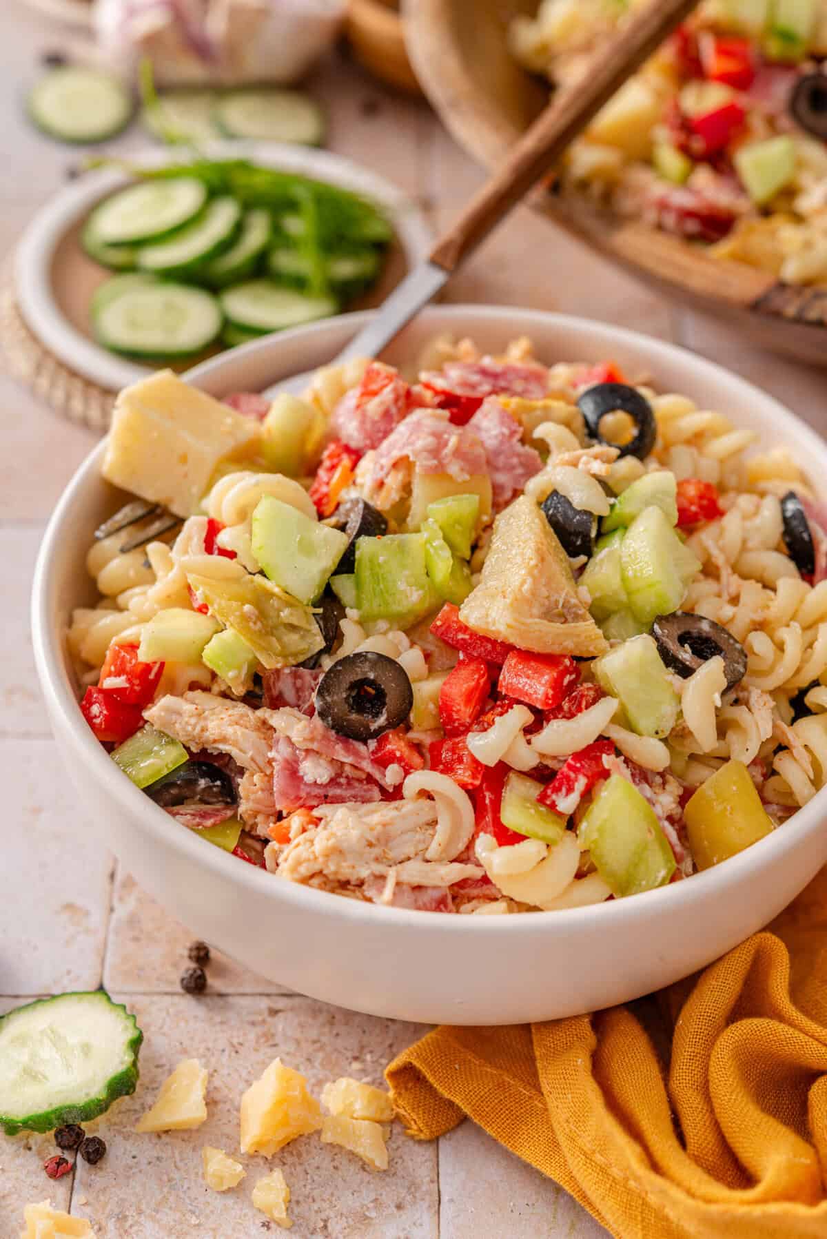 this is a side view close up of my  Italian Meal Prep Pasta Salad in a small serving bowl 