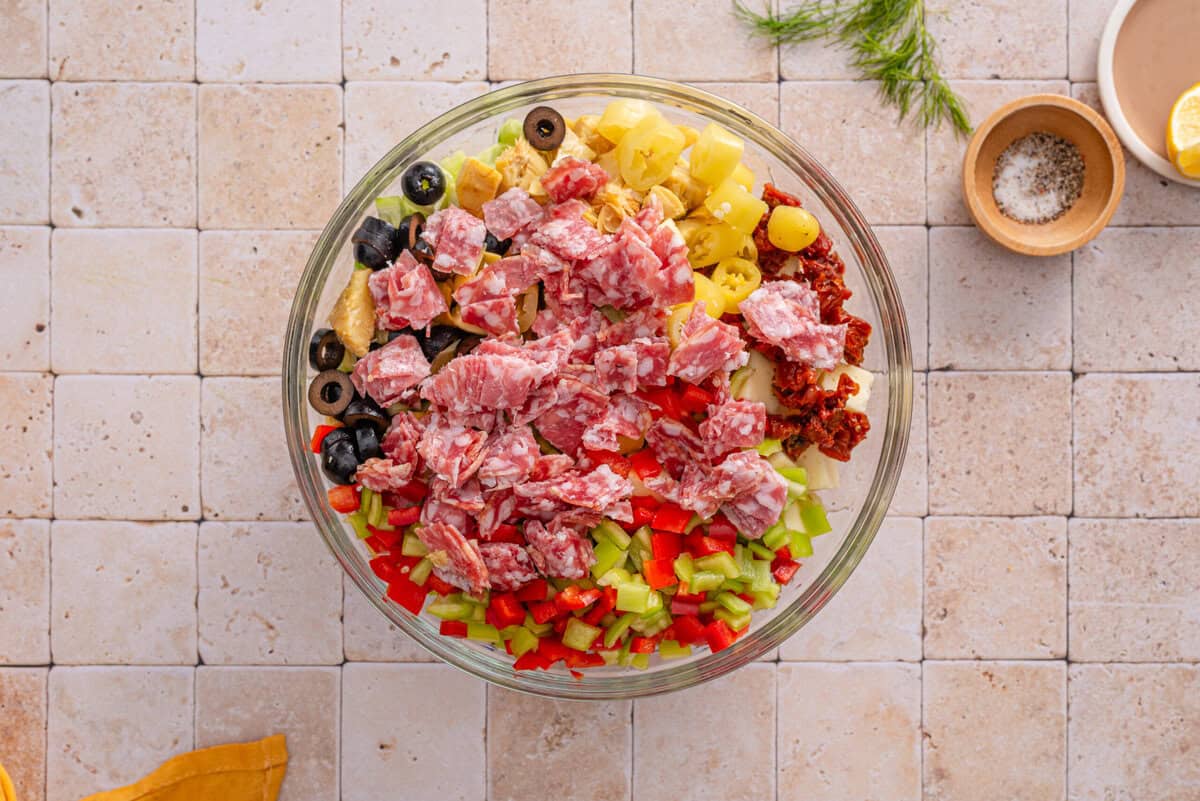 this shows me adding everything into a salad bowl 