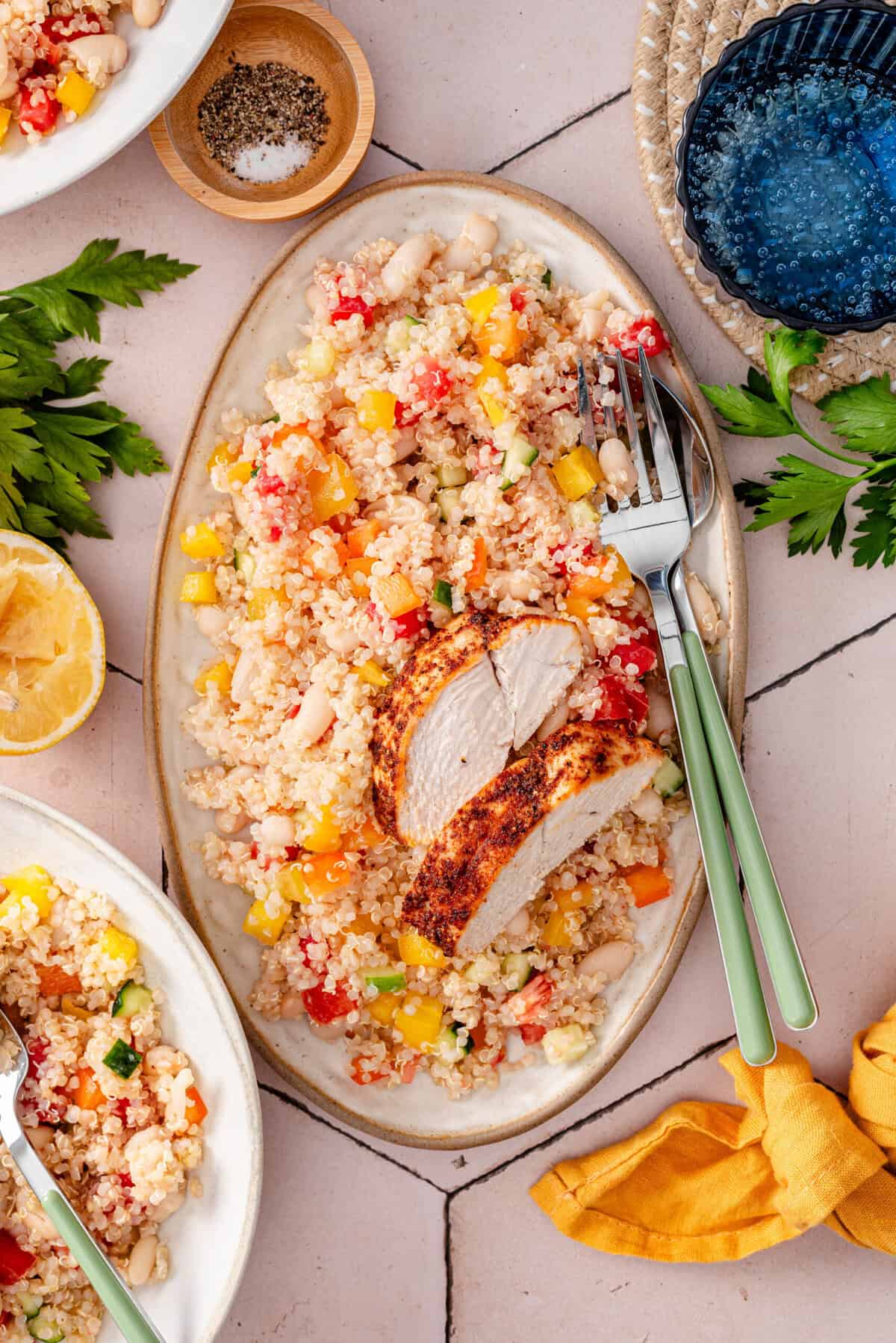 Overhead shot of garbanzo and quinoa salad served with chicken.
