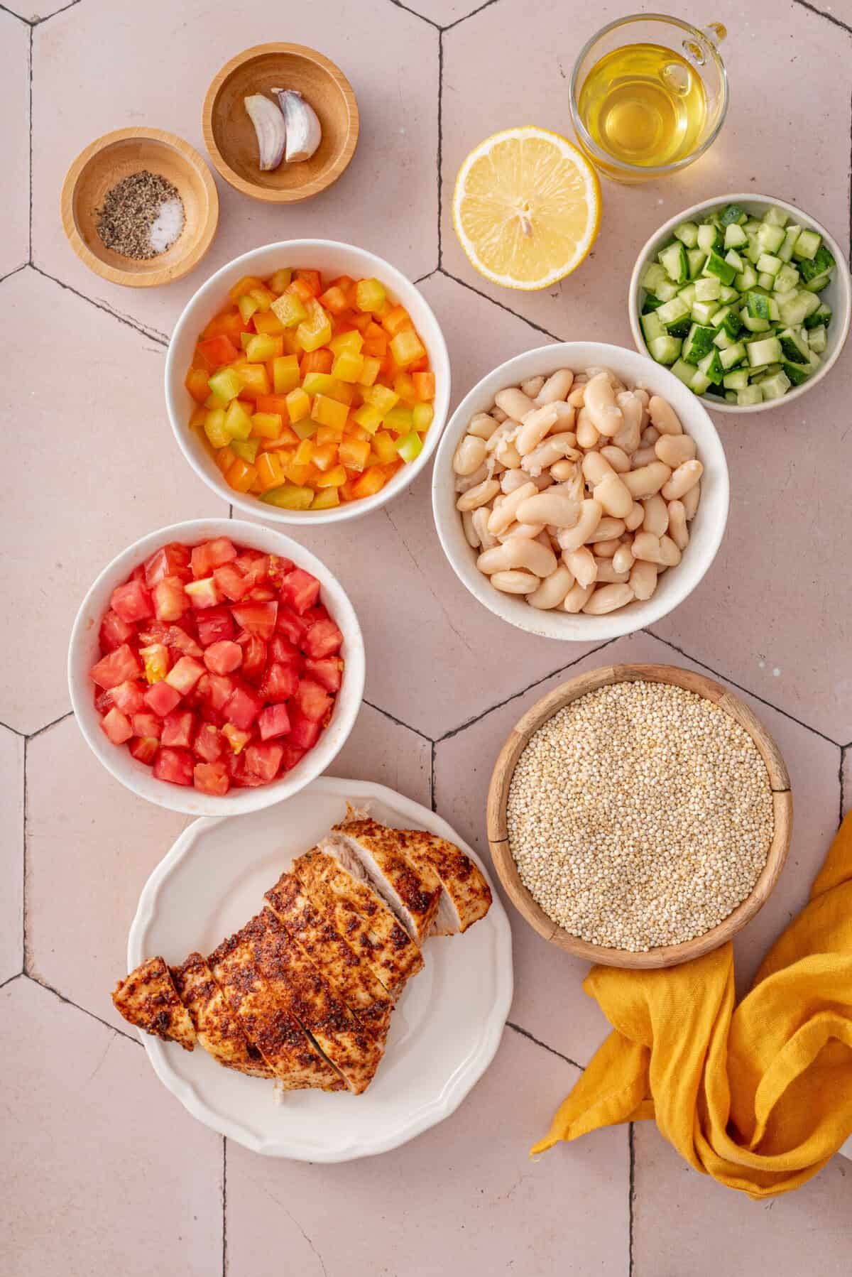 Overhead shot of all ingredients needed for garbanzo and quinoa salad.