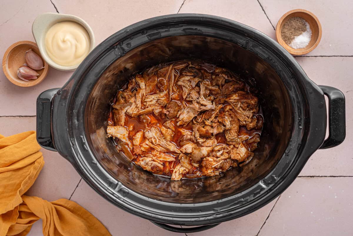 Overhead shot of cooked chicken shredded.