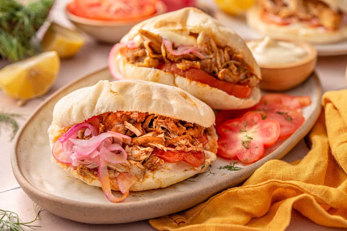 Side shot of chicken shawarma assembled and served.