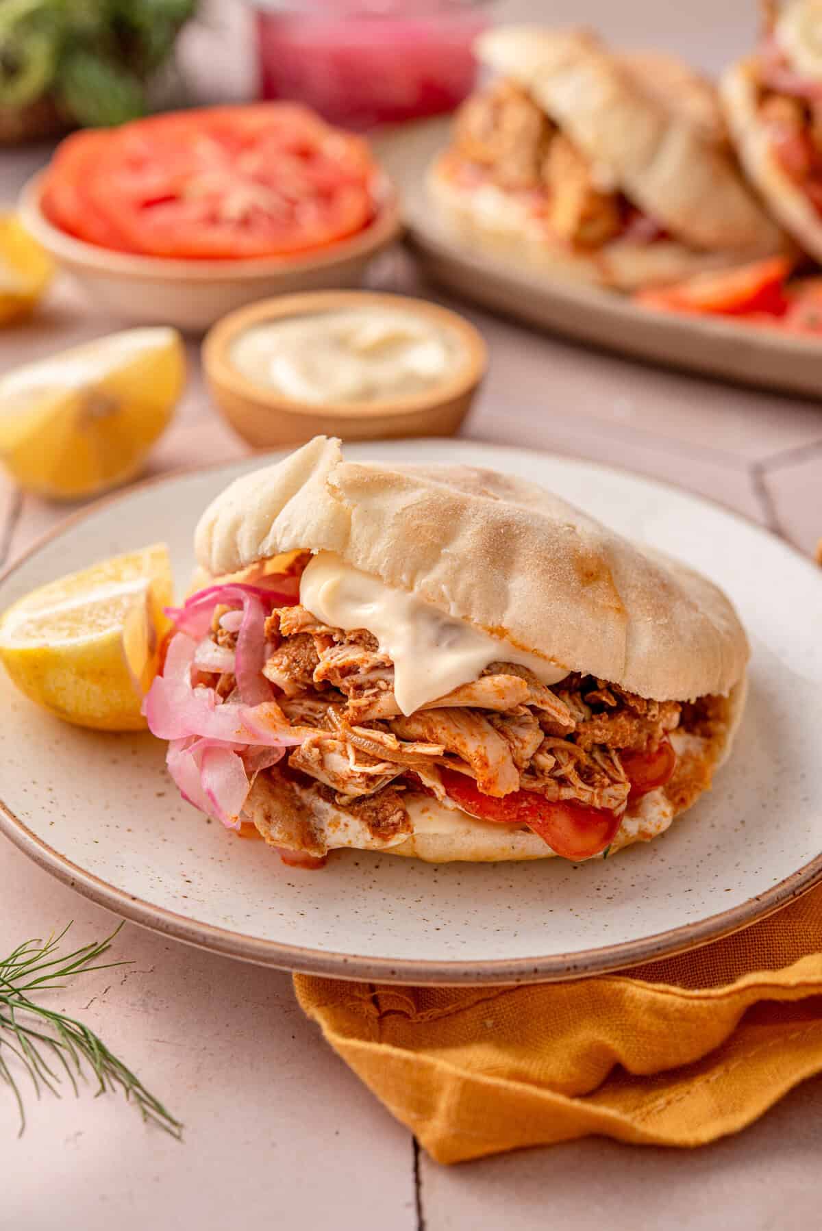 Side angle shot of my slow cooker chicken shawarma in pita bread.