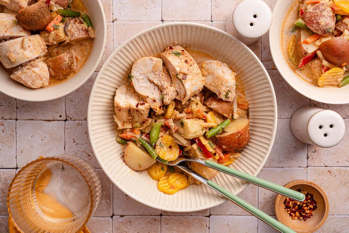 Overhead shot of coconut red curry chicken and potatoes.