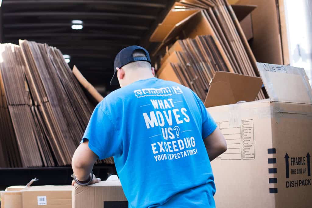 Element mover unloading packing boxes from a truck