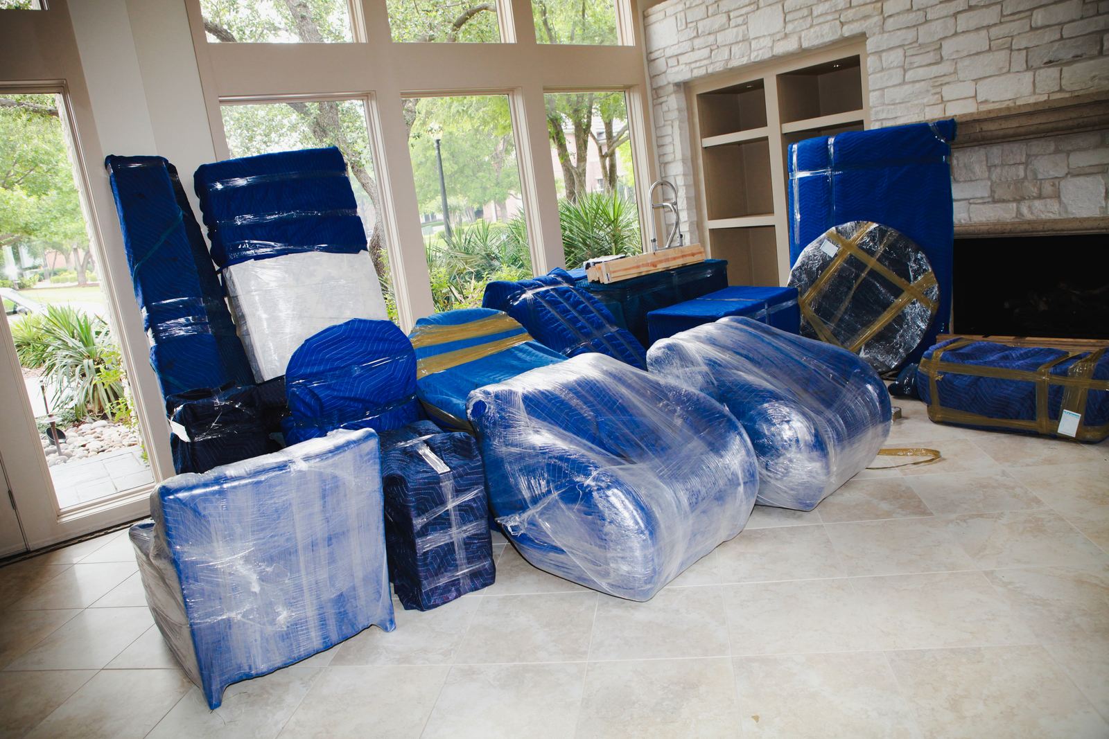 Furniture wrapped and protected by Element Moving & Storage crews inside a Dallas home
