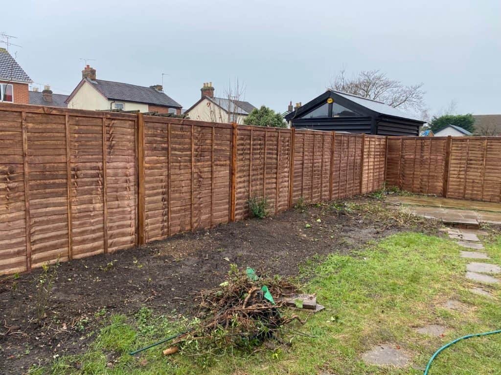 Freshly installed wooden garden fence in Suffolk for privacy and security.