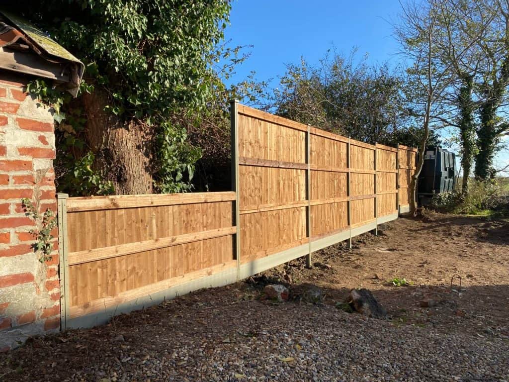 New wooden garden fence installed in Suffolk for privacy and security.