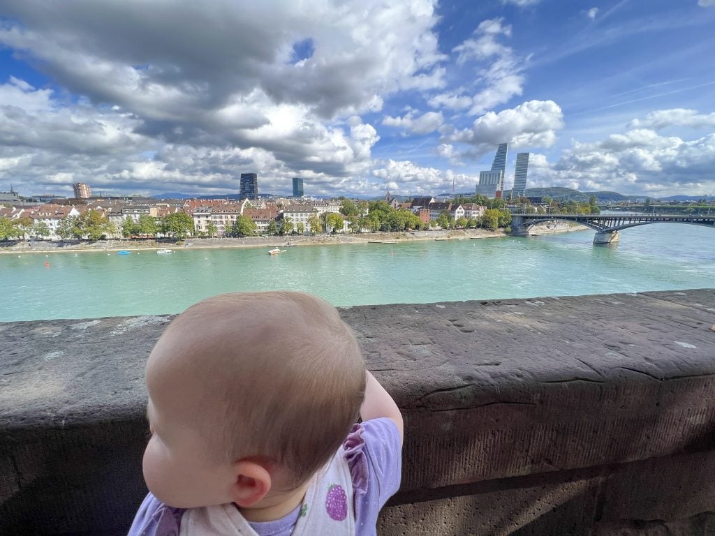 Beautiful view of Basel city skyline and Rhine River from a child-friendly viewpoint.