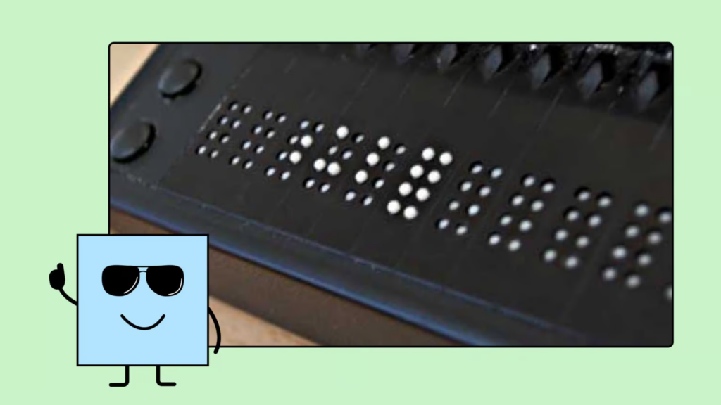 Manfred, our blind mascot, gives a thumbs-up to the Braille display shown next to him. It helps him to read text on the web.
