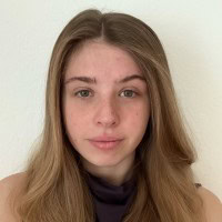 a young woman with long blond hair and a slight smile on her face.