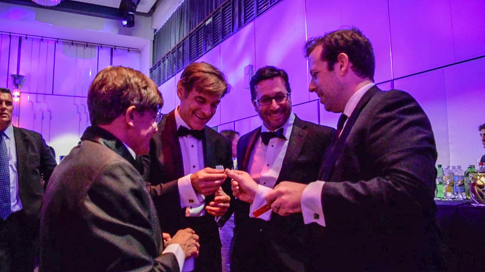 Magician facilitating conversations and interactions at a networking reception.