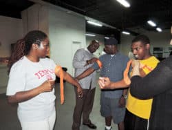 Temple University Hospital Nurse Aisha Washington demonstrates how to use a tourniquet (Photo courtesy of Temple University Hospital).
