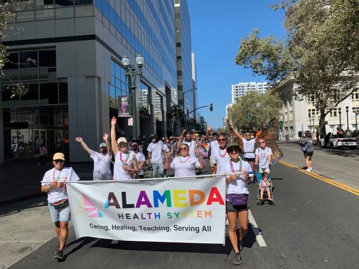 Alameda Health System staff marching in the Oakland Pride Parade.