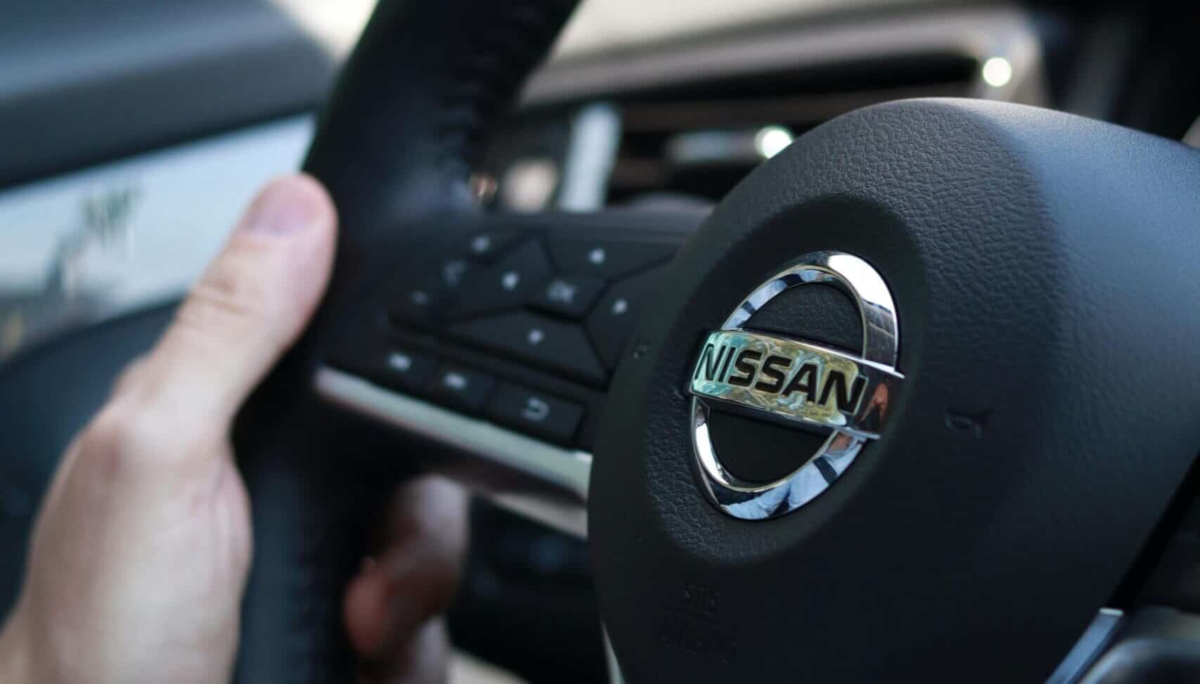 nissan logo on black steering wheel