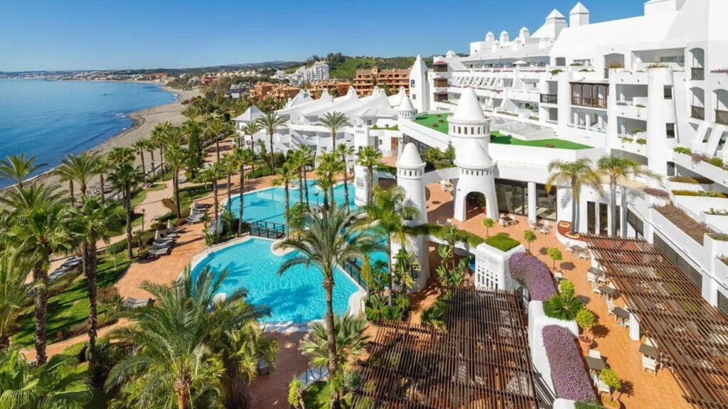 White resort with blue pool