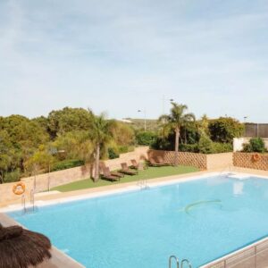 Resort swimming pool with palm trees