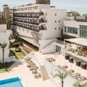 Resort buildings with outdoor seating.