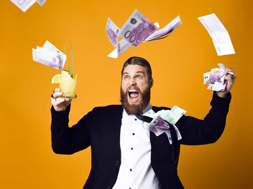Is there a future for European schools? 2 man throwing money away and partying