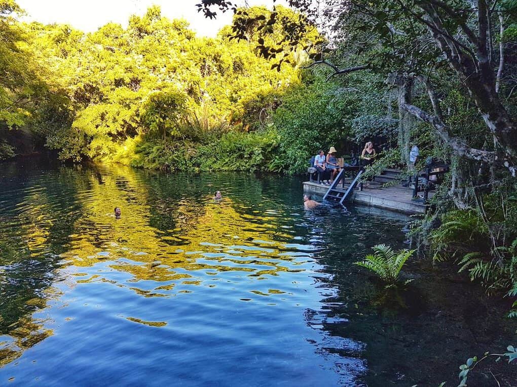 Swimming in the blue lagoon of Ojos Indigenas Reserve in Puntacana