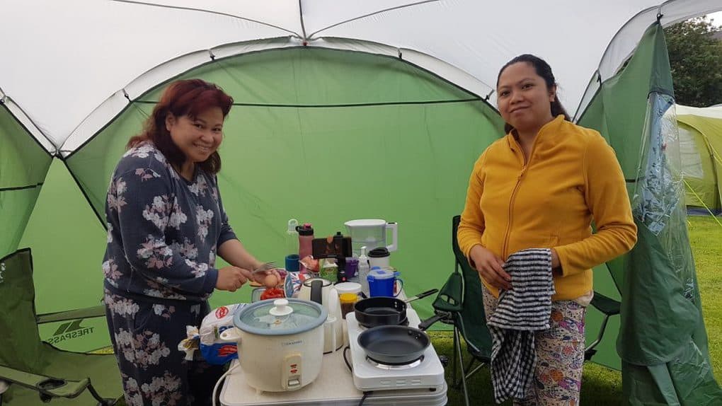Cooking our breakfast inside our camping gazebo