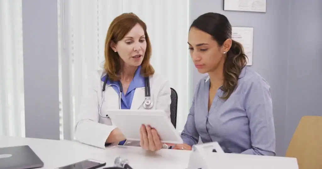 Clinical Trials San Diego: Doctor explaining study details to a Hispanic woman participant