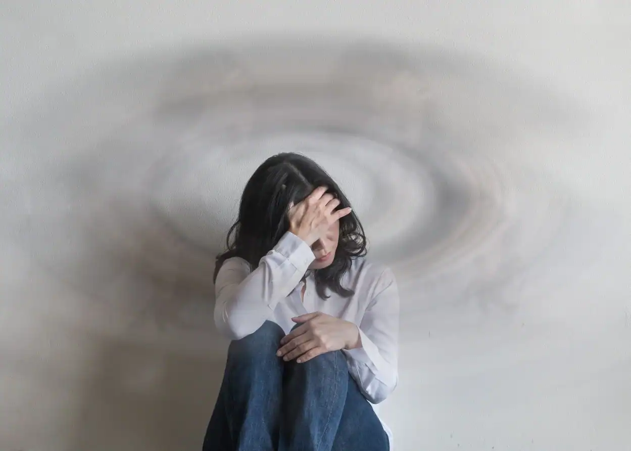 woman with symptoms who may qualify for a migraine clinical research study