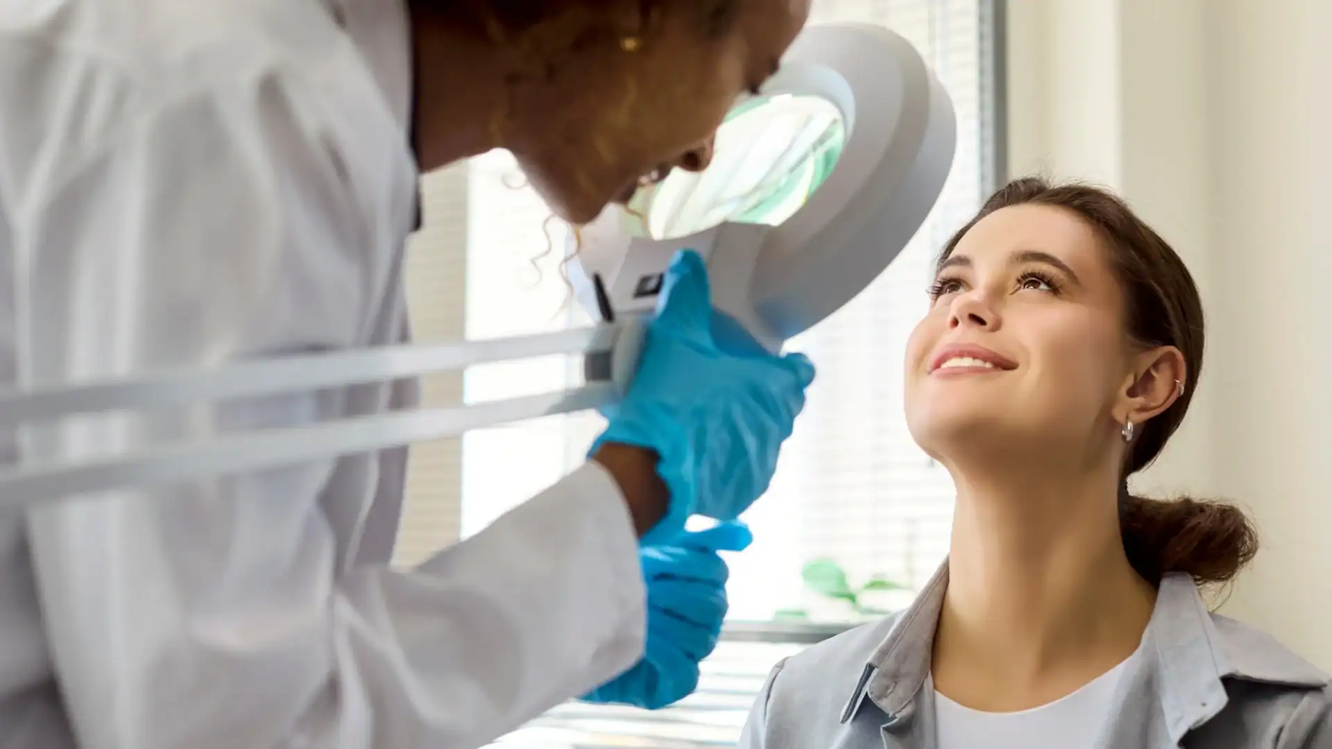 female doctor examining a patient for dermatology clinical trials raleigh nc