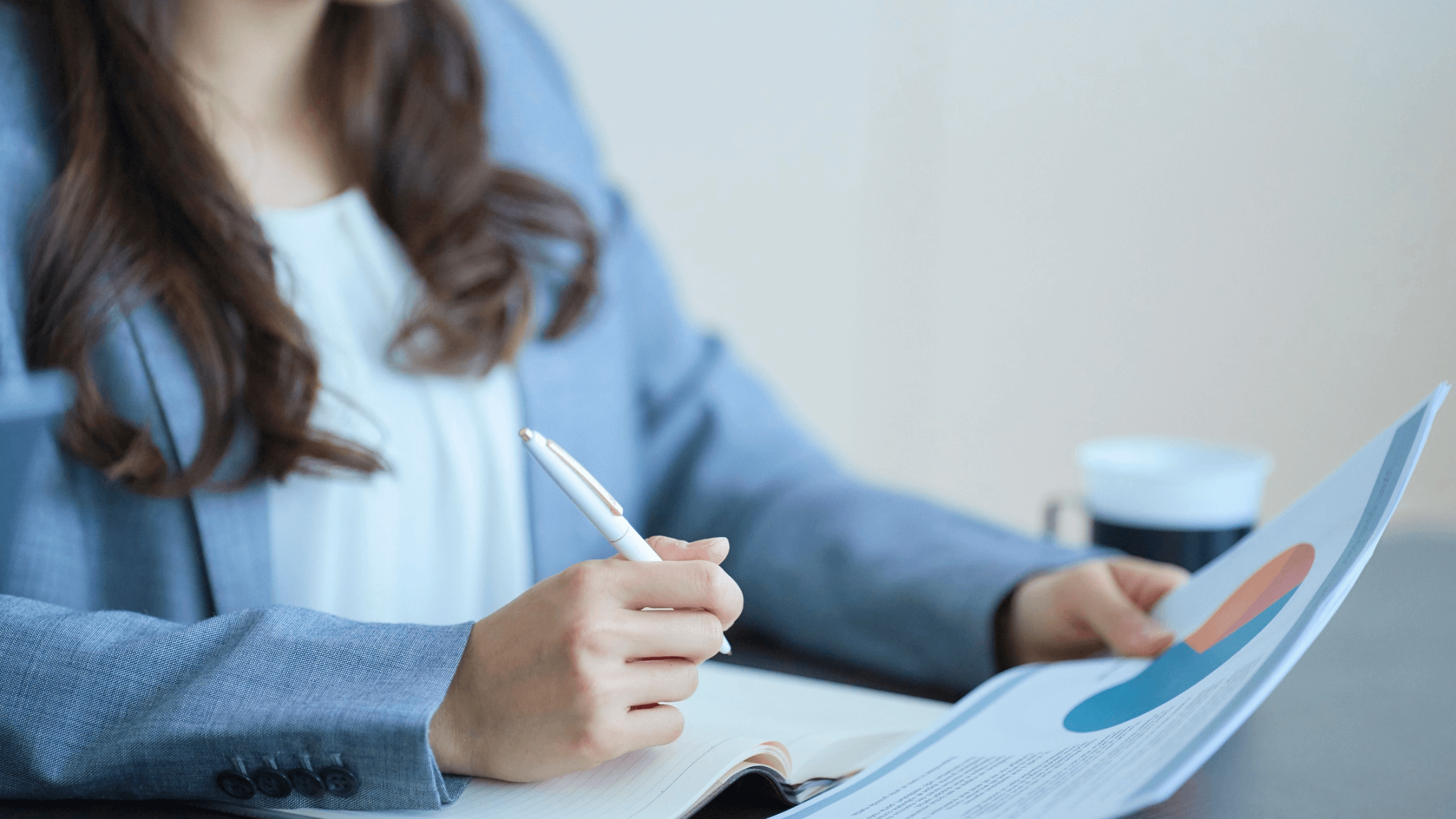 Photo of woman organizing financial information to prepare for sale of business