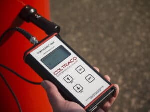 Man Liquid Level Testing Fire Cylinders