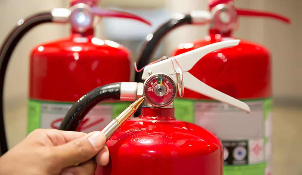 Fire Extinguisher being inspected