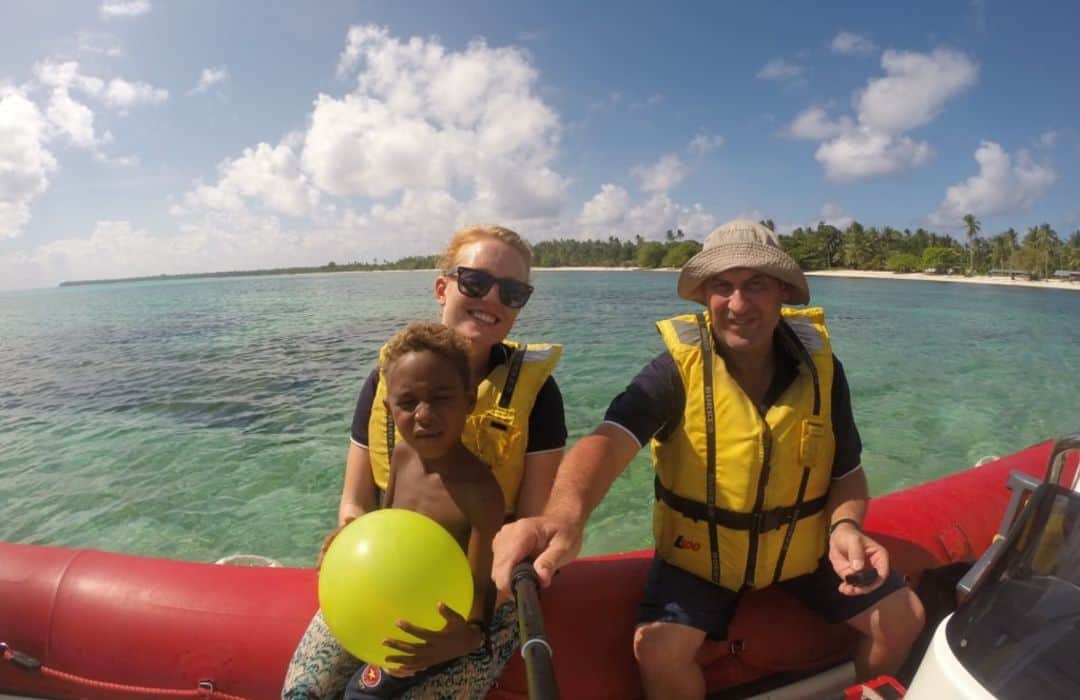 YWAM man and woman in zodiac in PNG