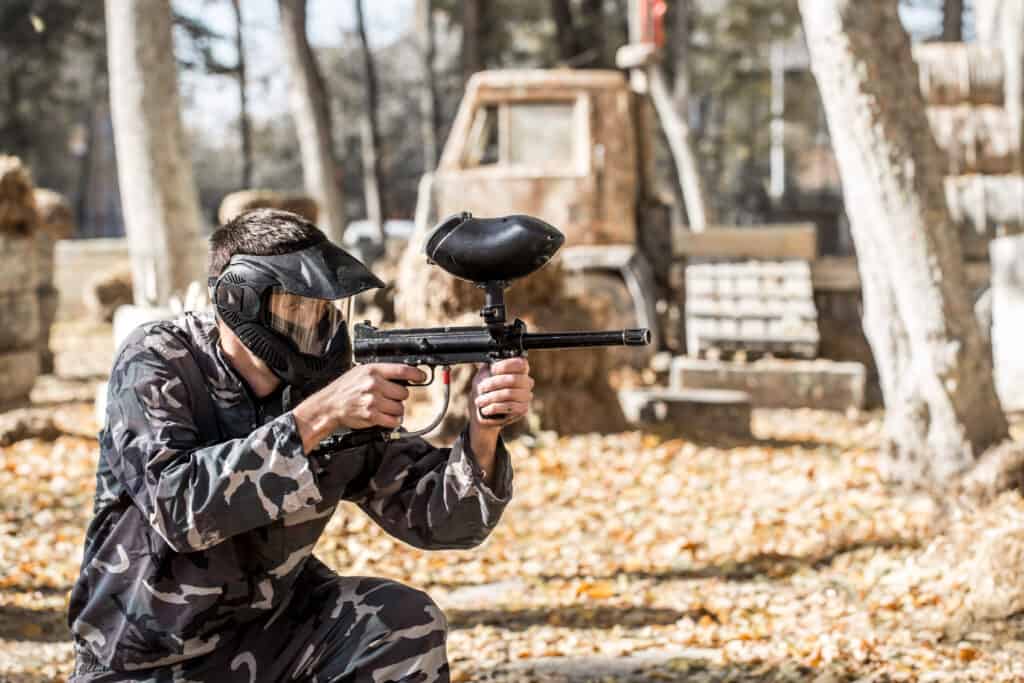 Man Shooting Paintball Gun