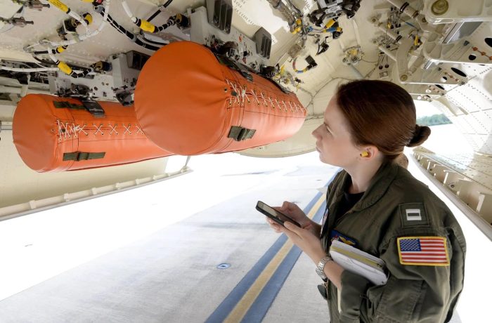 Aviation inflation life rafts being tested inside an aircraft.