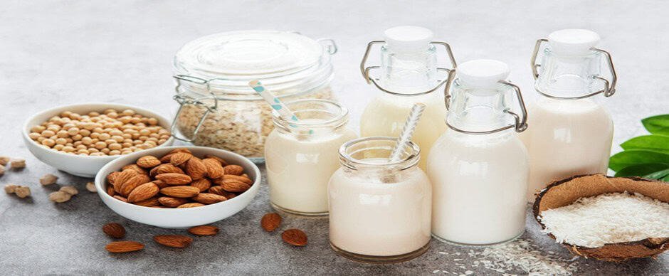 Dairy products and almonds on a kitchen countertop for food safety and hygiene.