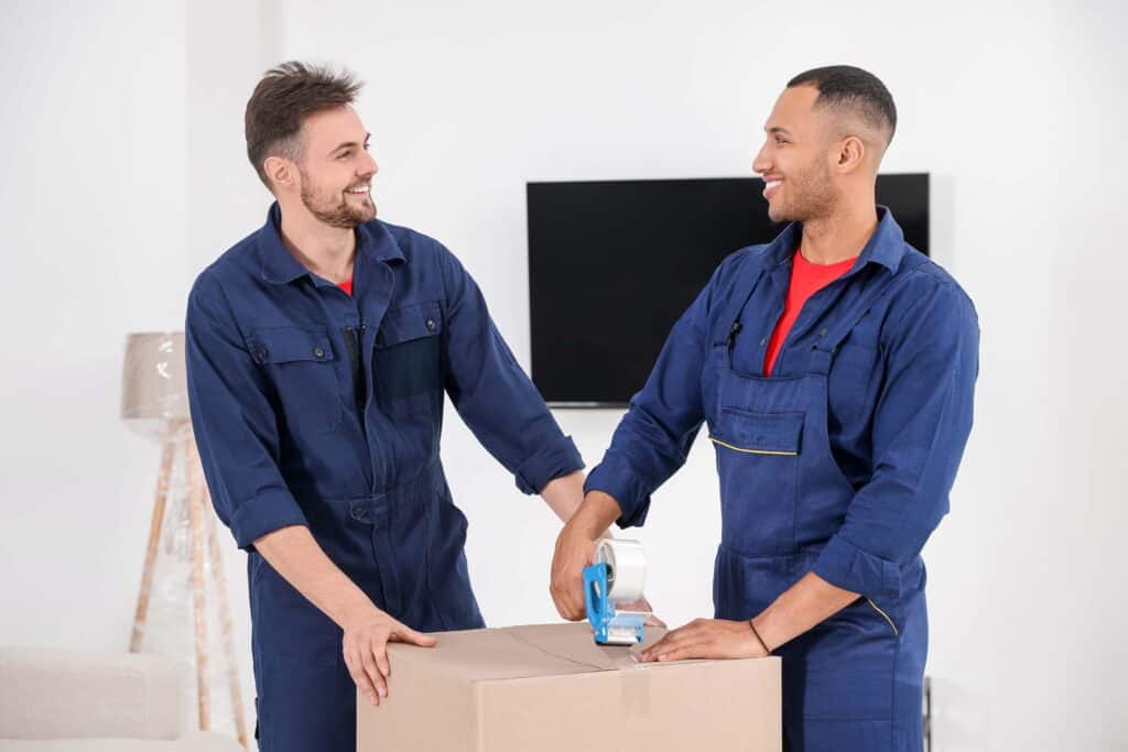 male movers packing box with adhesive tape in hous 2026 02 03 17 12 00 utc Baldivis