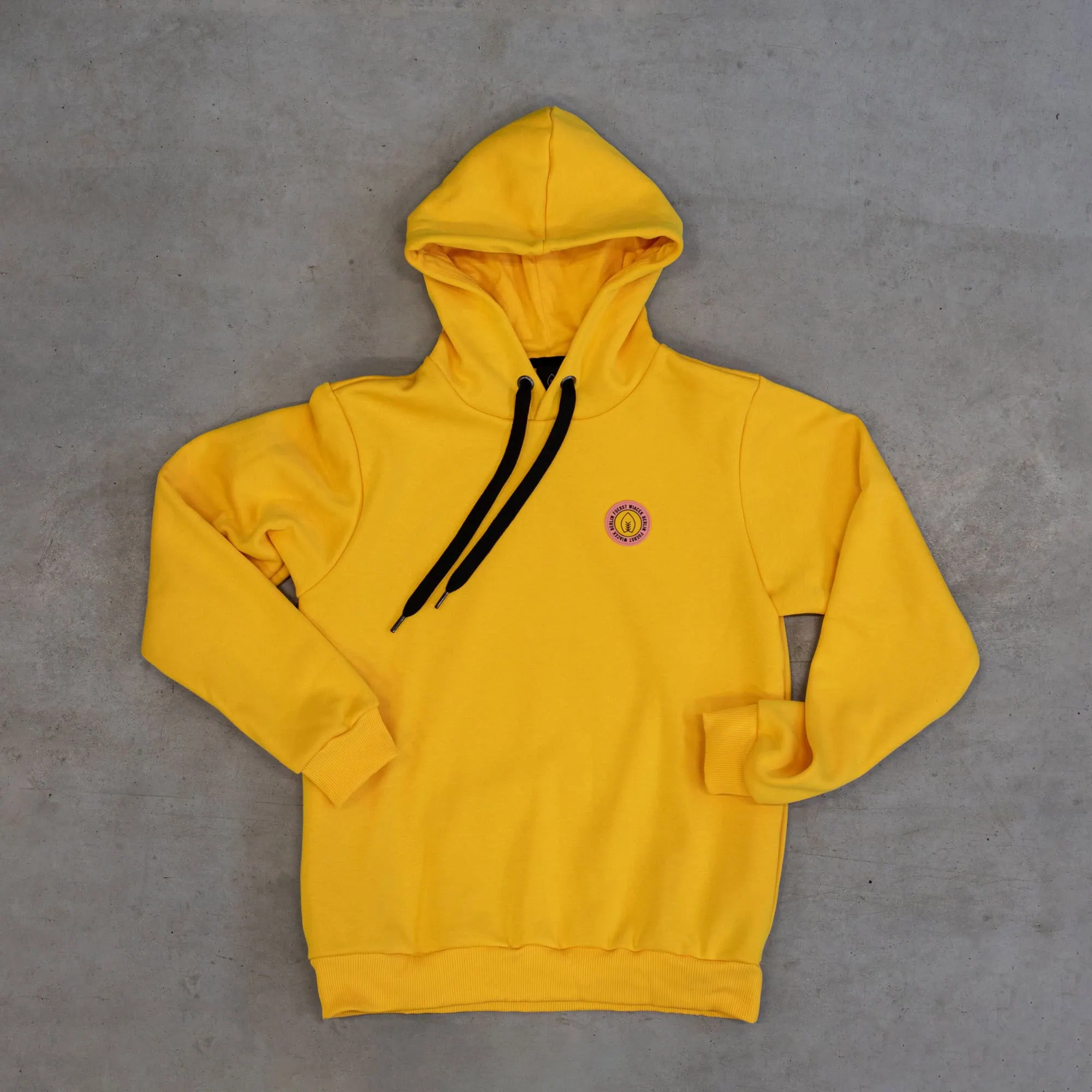 Yellow hoodie with FUERST WIACEK brewery emblem, casual apparel, stylish sweatshirt, branded clothing, comfortable streetwear.