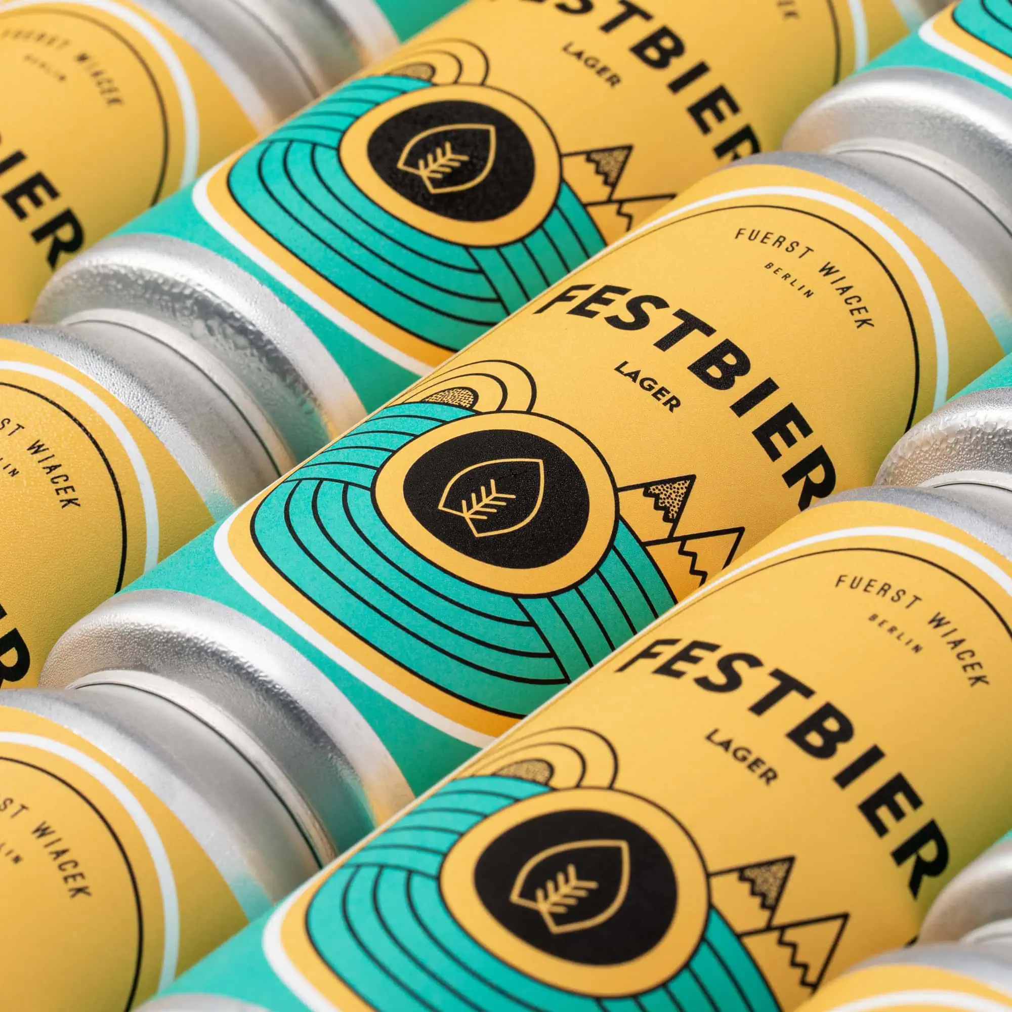Fuerst Wiacek Festbierz Lager beer cans featuring vibrant yellow, turquoise, and black design, highlighting the brewery's signature style and craft beer craftsmanship.