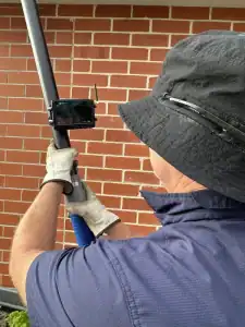 G2G Gutters using a cameral to inspect gutters