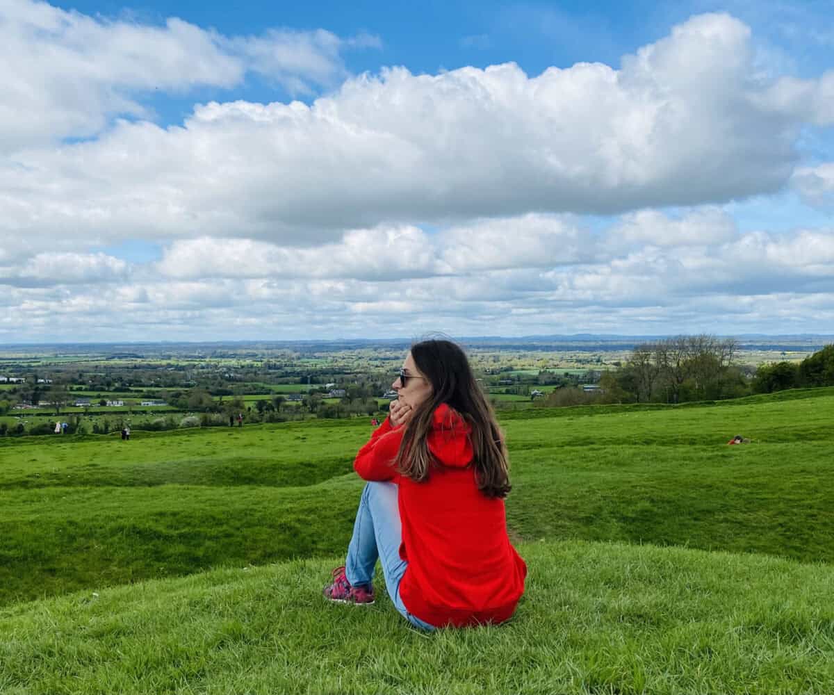 Private Day Tour. relaxing time in nature green hills lady enjoying the scenic views on Irish countryside rural Ireland
