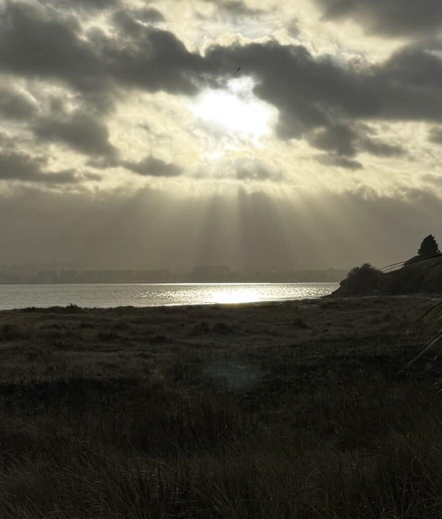 The sun breaks through the clouds after the storm in Dublin Bay