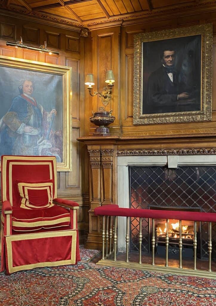 Elegant room with fireplace and portraits