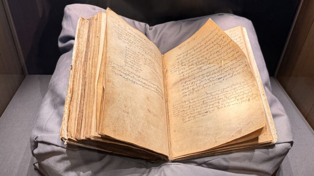 Open historical manuscript on display