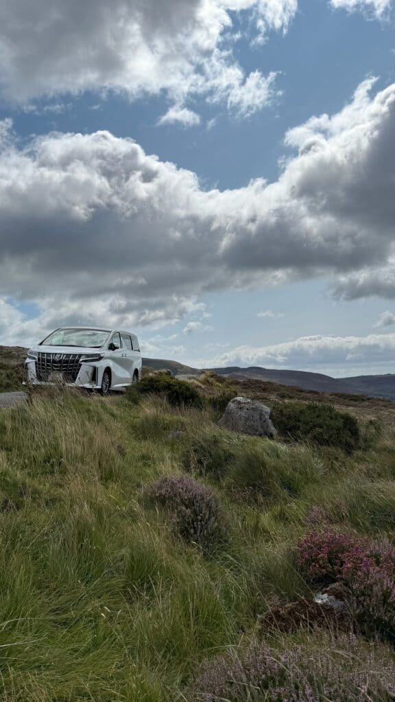 Car parked in scenic mountain landscape in the Wicklow Mountains