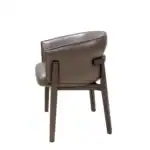Modern brown leather dining chair with wooden legs by Geluoer Furniture.