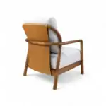 Contemporary wooden armchair with grey fabric and brown leather backrest, stylish modern furniture.