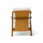 Modern wooden armchair with beige upholstery and curved backrest, stylish and comfortable furniture piece.