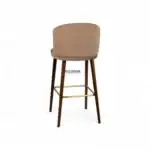 Modern beige upholstered wooden bar stool with gold footrest, stylish kitchen and dining furniture.