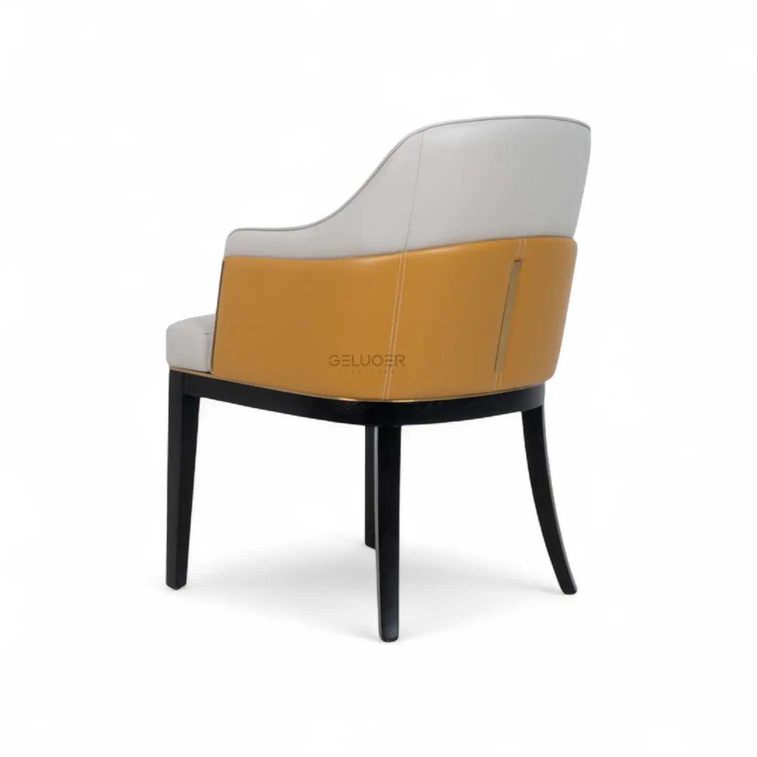 Luxurious modern armchair with white and mustard upholstery, black wooden legs, stylish and comfortable furniture piece.